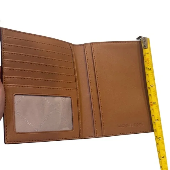 Michael Kors Brown MK Monogram Canvas Passport Holder Wallet 35H9GTVT1B EUC
EUC - Picture 9 of 10